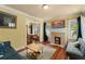 Living room view with a fireplace, television, and comfortable seating at 2223 Amherst Ave, Orlando, FL 32804