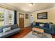 Bright living room featuring hardwood floors, neutral walls, and comfortable furnishings at 2223 Amherst Ave, Orlando, FL 32804