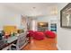 Comfortable living room featuring hardwood floors, colorful decor, and a cozy atmosphere at 2223 Amherst Ave, Orlando, FL 32804