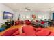 Spacious open-concept living room with natural light, hardwood floors, and modern decor at 2223 Amherst Ave, Orlando, FL 32804