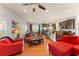 Open concept living room connects kitchen and dining areas with hardwood floors, plenty of natural light at 2223 Amherst Ave, Orlando, FL 32804