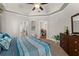 Comfortable bedroom with neutral walls and views into home office and kitchen at 2223 Amherst Ave, Orlando, FL 32804