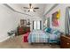 Spacious bedroom featuring tray ceilings, soft carpet, and access to a private balcony at 2223 Amherst Ave, Orlando, FL 32804