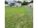 A spacious backyard enclosed with a chain-link fence, perfect for outdoor activities at 2711 Cranmoor Dr, Kissimmee, FL 34758