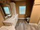 Well-lit bathroom with vinyl flooring, vanity, and toilet at 2711 Cranmoor Dr, Kissimmee, FL 34758