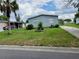 A well-maintained home with a long driveway and lawn at 2711 Cranmoor Dr, Kissimmee, FL 34758