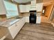 Modern kitchen featuring updated cabinets, countertops, and flooring at 2711 Cranmoor Dr, Kissimmee, FL 34758