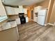A bright kitchen showcasing clean appliances, a large sink, and sleek cabinets at 2711 Cranmoor Dr, Kissimmee, FL 34758