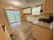 A kitchen with modern appliances, updated counter tops and access to a screened lanai at 2711 Cranmoor Dr, Kissimmee, FL 34758