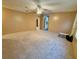 Bright living room features neutral walls, plush carpeting at 2711 Cranmoor Dr, Kissimmee, FL 34758