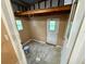 Shed interior featuring open floor, neutral walls and access door at 2711 Cranmoor Dr, Kissimmee, FL 34758