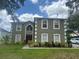 Charming two-story home features a well-manicured lawn and lush landscaping at 2818 Sheila Dr, Apopka, FL 32712