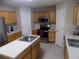 Well-lit kitchen featuring wood cabinets, stainless steel appliances, and a kitchen island at 2818 Sheila Dr, Apopka, FL 32712