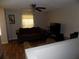 Cozy living room with hardwood floors and a ceiling fan at 2818 Sheila Dr, Apopka, FL 32712