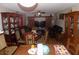 Classic living and dining area boasting hardwood floors, elegant furniture, and cozy lighting at 2818 Sheila Dr, Apopka, FL 32712