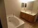 Relaxing main bathroom with a soaking tub and double sink vanity at 2818 Sheila Dr, Apopka, FL 32712