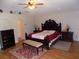 Cozy bedroom suite with hardwood flooring, a ceiling fan, and ample space at 2818 Sheila Dr, Apopka, FL 32712