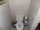 Clean half bathroom, with a standard toilet and minimal decor at 2818 Sheila Dr, Apopka, FL 32712