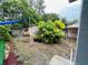 Muddy backyard features mature landscaping, small storage shed and gazebo at 2829 Sanford Ave, Sanford, FL 32773