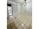 Dining area with tile flooring and sliding glass doors at 2829 Sanford Ave, Sanford, FL 32773