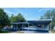 Charming single-story home featuring a covered carport and freshly painted in blue and grey at 2829 Sanford Ave, Sanford, FL 32773