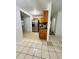 Kitchen and dining area with stainless steel refrigerator and tile floors at 2829 Sanford Ave, Sanford, FL 32773