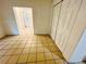 Open living room featuring tile floors and access to hallways at 2829 Sanford Ave, Sanford, FL 32773