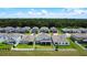 Aerial view of homes with white picket fences, showcasing a community's layout near a lush green area at 2943 Slough Creek Dr, Kissimmee, FL 34744