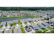Great aerial showing community homesites, some featuring solar panels and pond views at 2943 Slough Creek Dr, Kissimmee, FL 34744
