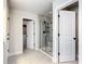 Bright bathroom with glass shower, closet, and neutral tiles at 2943 Slough Creek Dr, Kissimmee, FL 34744