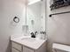 Bright bathroom featuring a modern vanity with a white countertop and sleek, black fixtures at 2943 Slough Creek Dr, Kissimmee, FL 34744