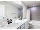 Bright bathroom with dual sinks, a large mirror, and modern fixtures, perfect for a refreshing and functional space at 2943 Slough Creek Dr, Kissimmee, FL 34744