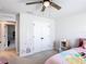 Comfortable bedroom boasts a built-in closet, fun decor, and a modern ceiling fan, perfect for rest and play at 2943 Slough Creek Dr, Kissimmee, FL 34744