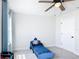 Charming ' bedroom with a blue race car bed, ceiling fan, and bright natural light at 2943 Slough Creek Dr, Kissimmee, FL 34744