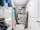 Organized walk-in closet featuring shelving and hanging racks, perfect for ample storage at 2943 Slough Creek Dr, Kissimmee, FL 34744