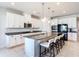 Modern kitchen featuring stainless steel appliances, granite countertops, and a center island with seating at 2943 Slough Creek Dr, Kissimmee, FL 34744