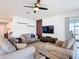 Comfortable living room with modern decor, including a large TV and stylish wood accents at 2943 Slough Creek Dr, Kissimmee, FL 34744