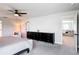 Spacious main bedroom featuring a ceiling fan and a connected seating area and a double dresser at 2943 Slough Creek Dr, Kissimmee, FL 34744