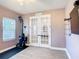Bright office space featuring stylish French doors and modern finishes, ideal for a home workspace at 2943 Slough Creek Dr, Kissimmee, FL 34744