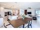 Open floor plan connecting the kitchen, dining area, and living room for seamless entertaining at 2943 Slough Creek Dr, Kissimmee, FL 34744