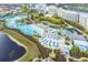 Beautiful aerial view of the community pool and surrounding recreation areas and buildings at 3036 Parrot Head Pl, Kissimmee, FL 34747