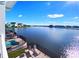 Take in the waterfront view from this home's balcony, overlooking a splash pool and lake at 3036 Parrot Head Pl, Kissimmee, FL 34747