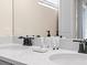 Bathroom featuring double sinks with white countertops and modern matte black faucets and fixtures at 3036 Parrot Head Pl, Kissimmee, FL 34747