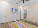 Bedroom with two twin beds, dresser with television, and doorway to the en suite bathroom at 3036 Parrot Head Pl, Kissimmee, FL 34747