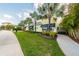 Exterior view of a bright clubhouse with well-maintained landscaping, providing a welcoming community atmosphere at 3036 Parrot Head Pl, Kissimmee, FL 34747