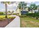 Exterior of 'Fins Up! Fitness' with a landscaped walkway, promoting a healthy and active lifestyle at 3036 Parrot Head Pl, Kissimmee, FL 34747