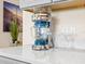 Close up of margarita maker with margarita glasses on white quartz countertops in the kitchen at 3036 Parrot Head Pl, Kissimmee, FL 34747
