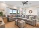 Spacious living room with a large sectional sofa, decor and view of the outdoors offering plenty of space to relax at 3036 Parrot Head Pl, Kissimmee, FL 34747