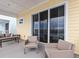 Inviting patio with comfortable seating and expansive views of the lake at 3036 Parrot Head Pl, Kissimmee, FL 34747