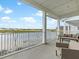 Spacious patio with comfortable seating overlooking a tranquil lake and community views at 3036 Parrot Head Pl, Kissimmee, FL 34747